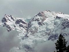 09 Nanga Parbat East Summit, Silver Saddle, North Peaks From Fairy Meadows Nanga Parbat came out of the clouds for just a few minutes at Fairy Meadows and I quickly took some photos with South East Peak (7530m) and Silberzacken East Summit (7597m), the large Silver Plateau snowfield, North Peak II (7785m), North Peak I (7816m) on the right stretching back towards the true summit (8125m).